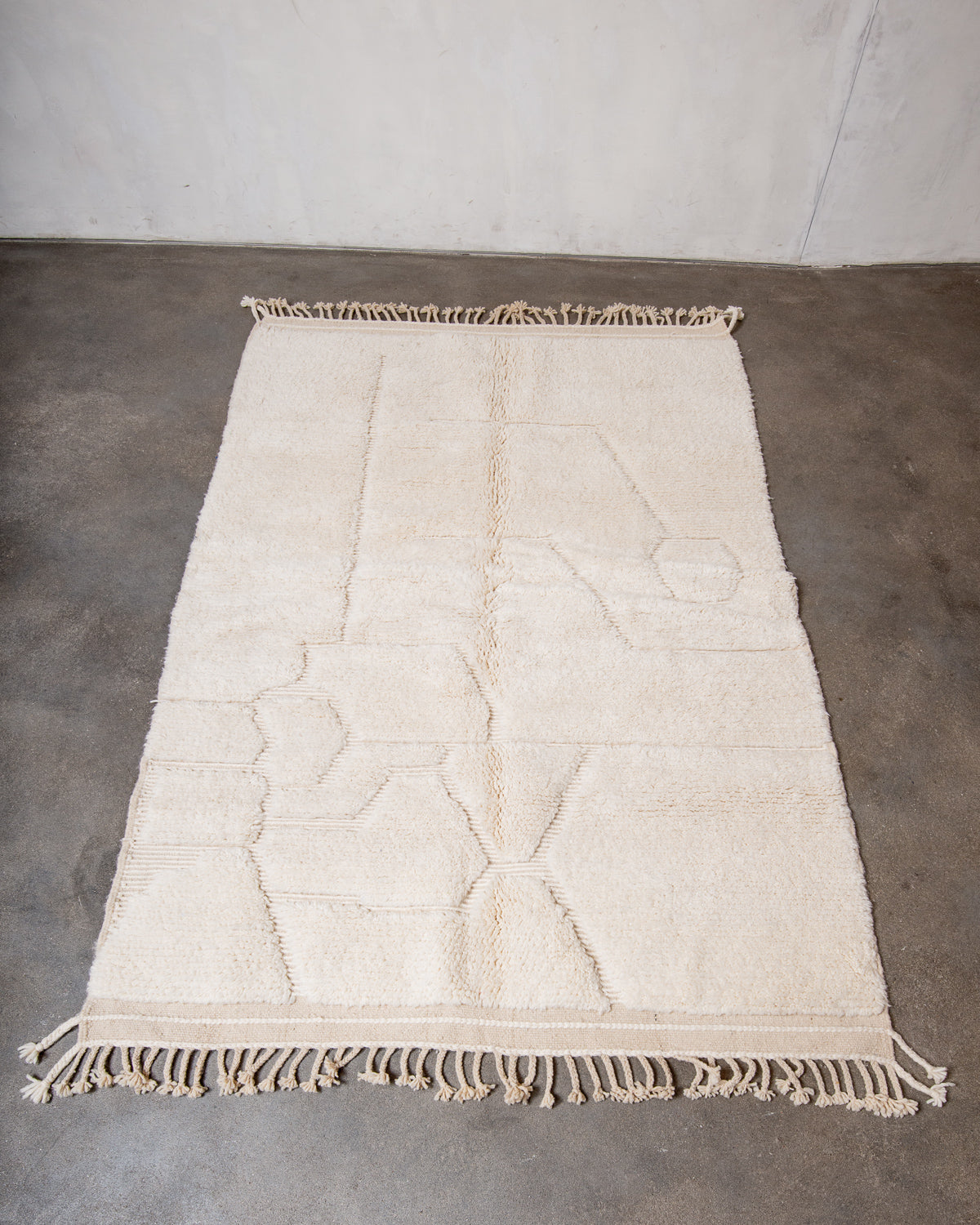 Modern, designer, handcrafted Berber rug from Morocco. Beniourain carpet with minimalist design, natural wool pile and a fluffy texture.